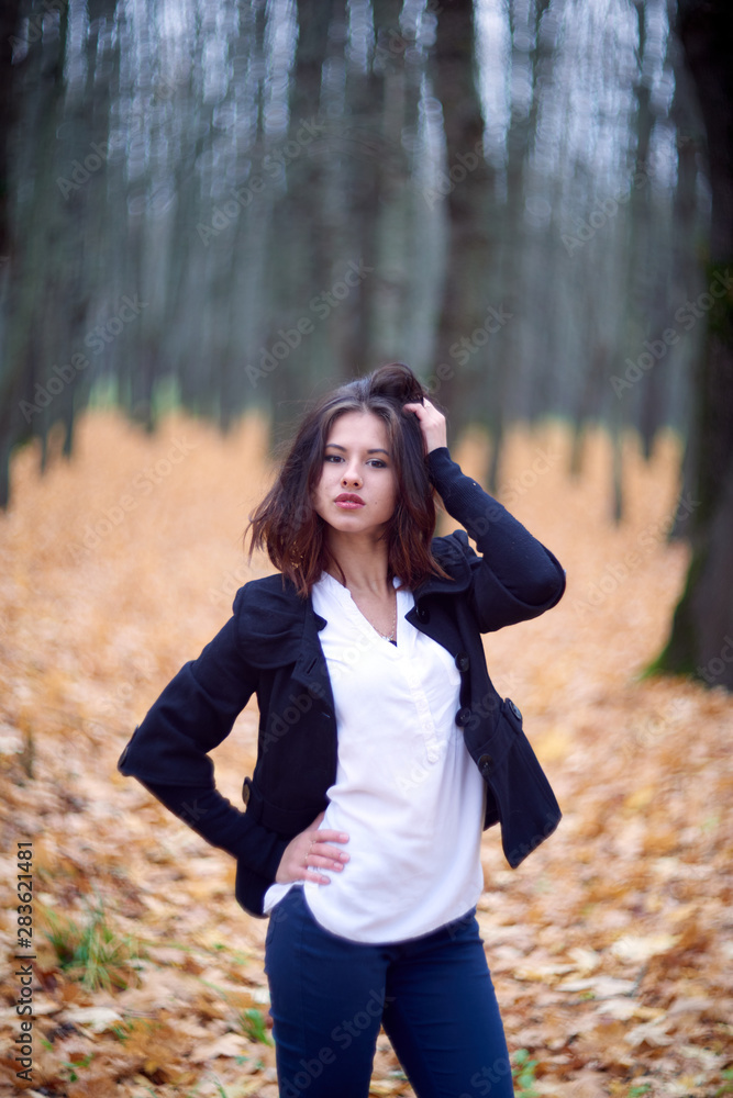 portrait of young woman in autumn park portrait of young woman in autumn park