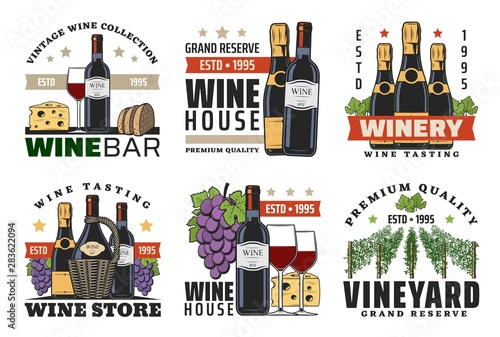 Wine bottles, glasses, grapes, bread and cheese