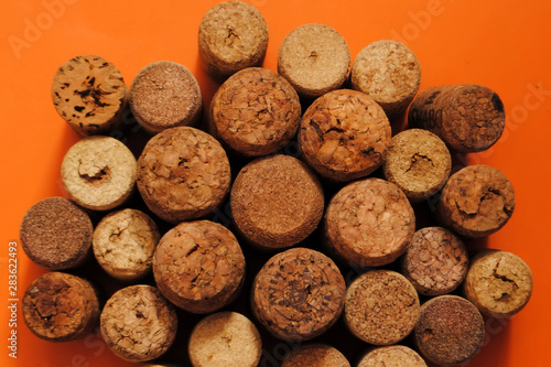 Wine corks on an orange background. Different wine corks.