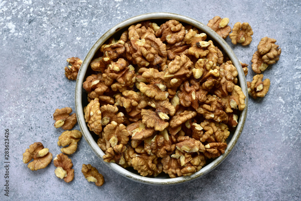 Bowl of peelled walnuts. Top view with copy space. Bowl of peelled walnuts. Top view with copy space.