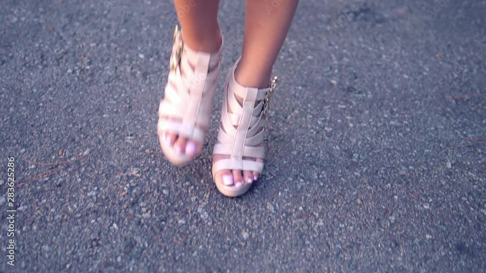 closeup shot of model legs walking down catwalk in the city closeup shot of model legs walking down catwalk in the city