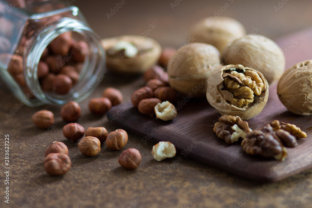 Filbert and walnuts on a rusty metal surface. Filbert and walnuts on a rusty metal surface.