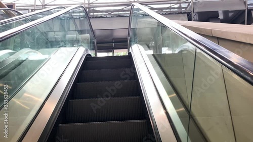 Working moving escalator in a large shopping center store. photo