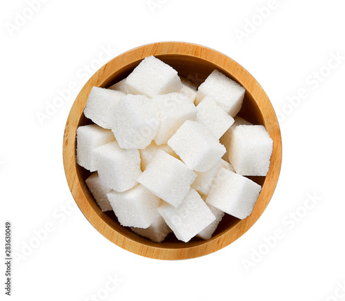 Sugar cubes in wood bowl on white background