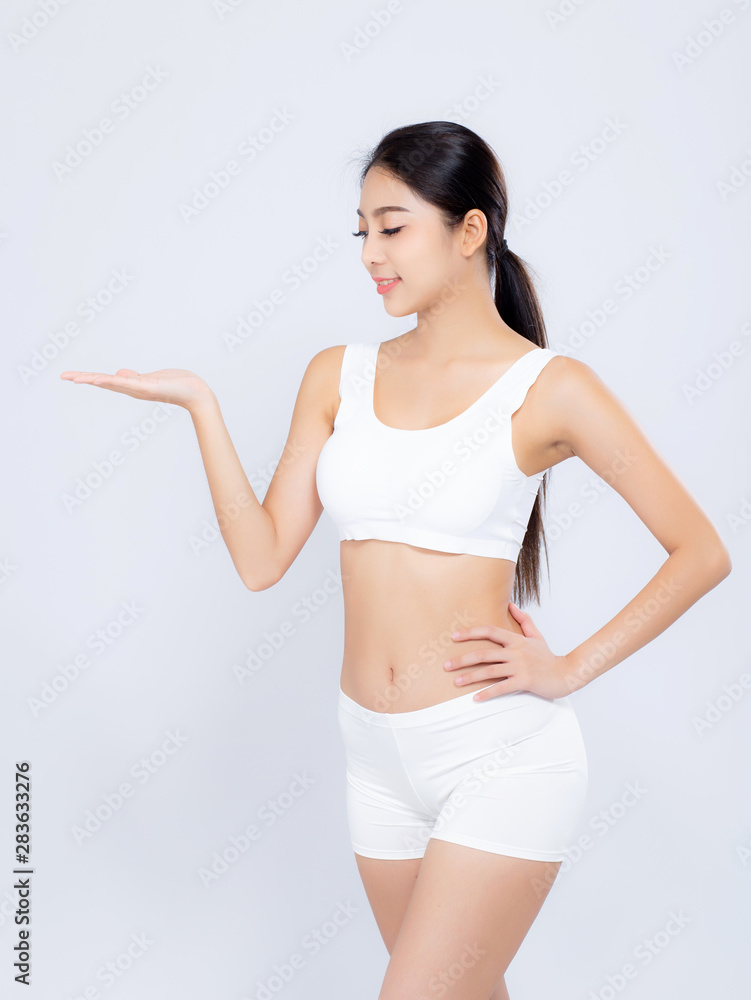 Portrait asian woman beautiful body diet with fit presenting something empty copy space on the hand isolated on white background, model girl weight slim with calories, health and wellness concept. Portrait asian woman beautiful body diet with fit presenting something empty copy space on the hand isolated on white background, model girl weight slim with calories, health and wellness concept.
