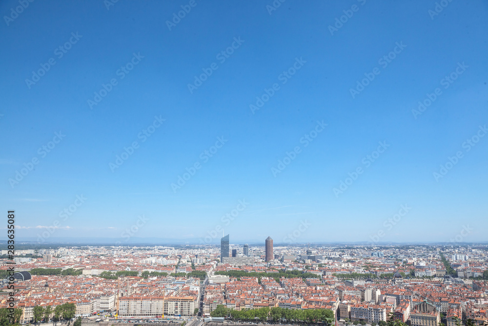 Aerial panoramic view of Lyon with the skyline of Lyon skyscrapers visible in background and Saone river in the foregroud, with the narrow streets of Old Lyon district