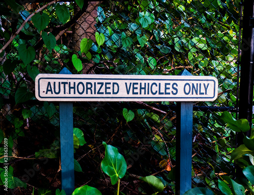 Authorized Vehicle Only Wooden Post Sign at a Public Park