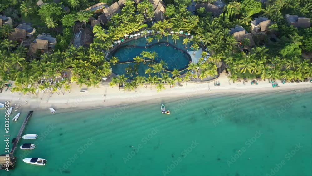 Hotel Beachcomber at the Trou aux Biches Beach in Mauritius. Drone shot with the DJI Mavic 2 Pro and awesome view with beautiful water. Hotel Beachcomber at the Trou aux Biches Beach in Mauritius. Drone shot with the DJI Mavic 2 Pro and awesome view with beautiful water.