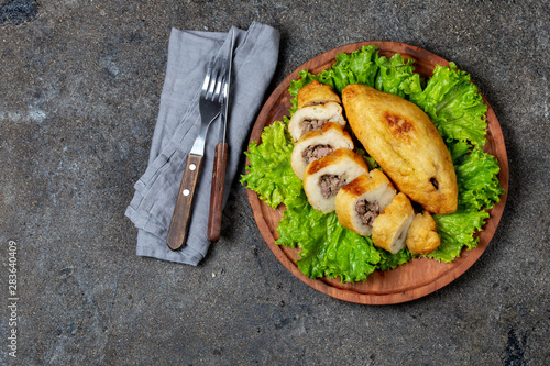 PERUVIAN CHILEAN traditional dish PAPA RELLENA meat stuffed mashed potato on wooden plate photo