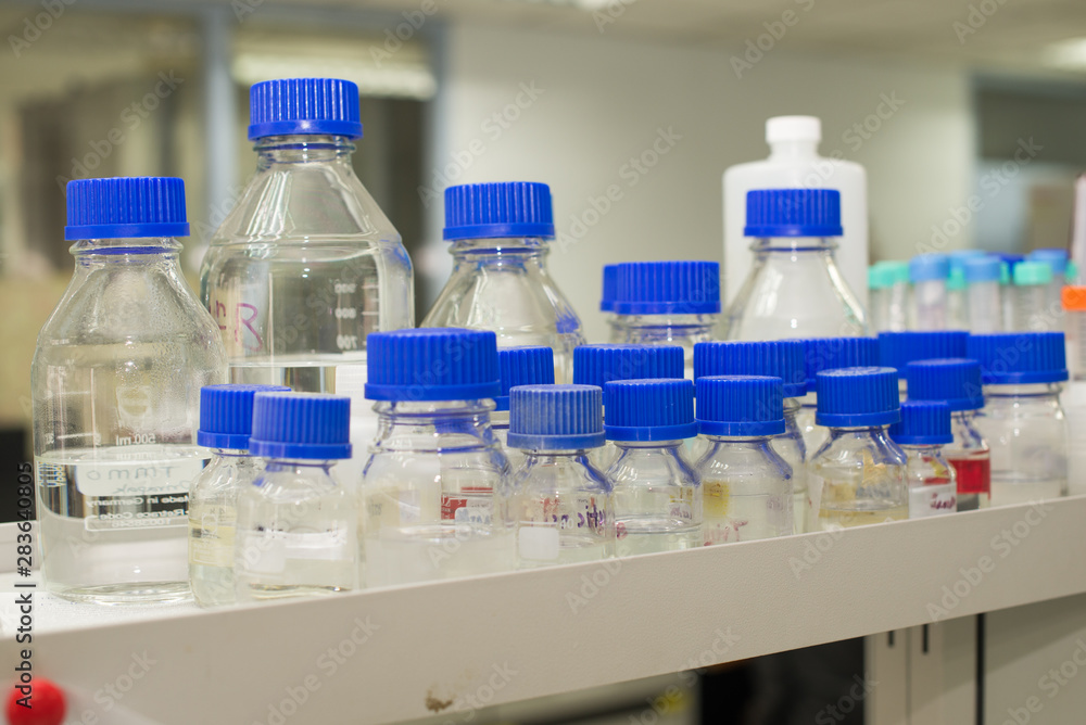 laboratory equipment pipette dropping sample into a test tube,abstract science background. laboratory equipment pipette dropping sample into a test tube,abstract science background.