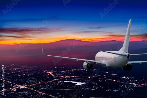 Wallpaper Mural Airplane  flying above the night town Torontodigital.ca