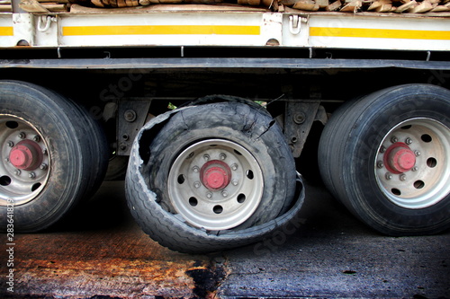 Damaged truck tires.damaged 18 wheeler semi truck burst tires by highway street.damaged tire after tire explosion at high speed on highway.