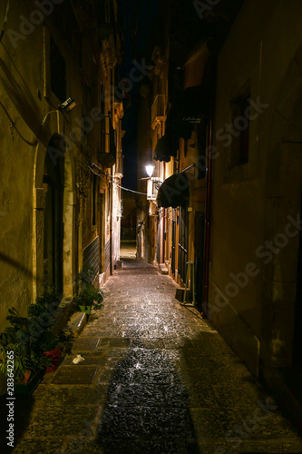 Syracuse  Sicily  Italy One of the many narrow alleys on Ortygia island at night.