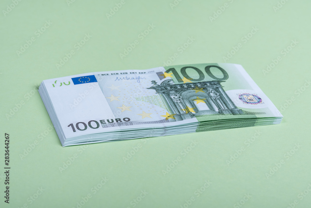 Euro cash on a green background. Euro Money Banknotes. Euro Money. Euro bill. Place for text.