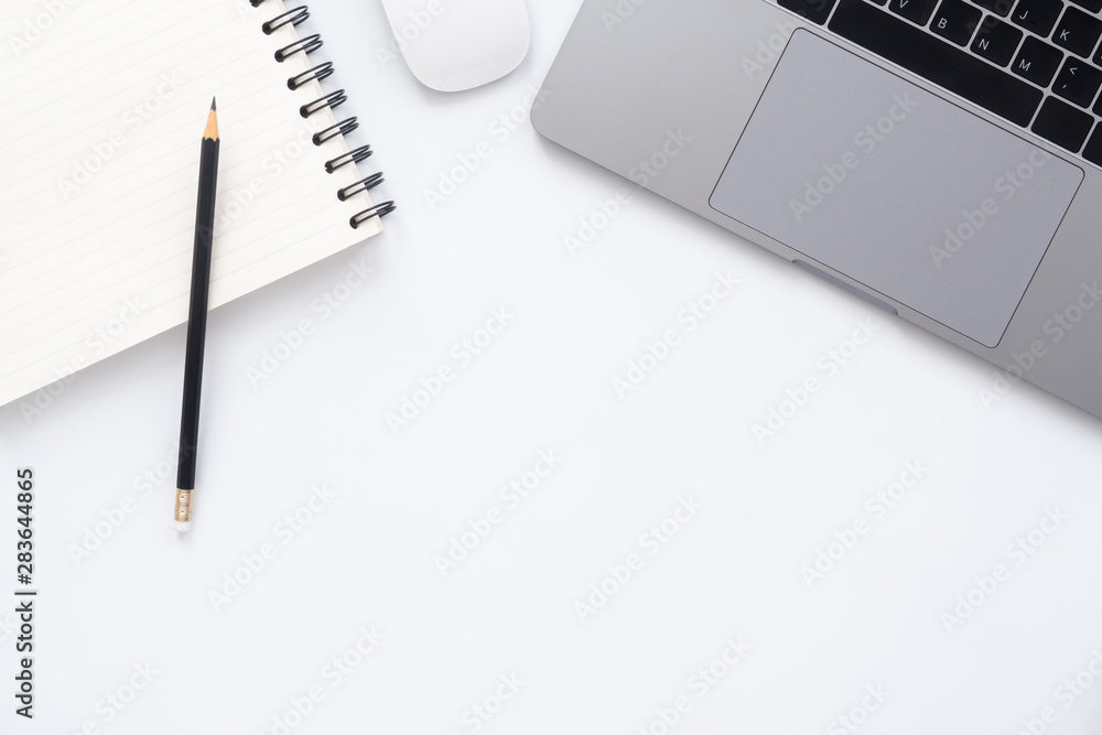 Creative flat lay photo of workspace desk. Top view office desk with laptop, pencil and notebook on white color background. Top view with copy space, flat lay photography. Creative flat lay photo of workspace desk. Top view office desk with laptop, pencil and notebook on white color background. Top view with copy space, flat lay photography.