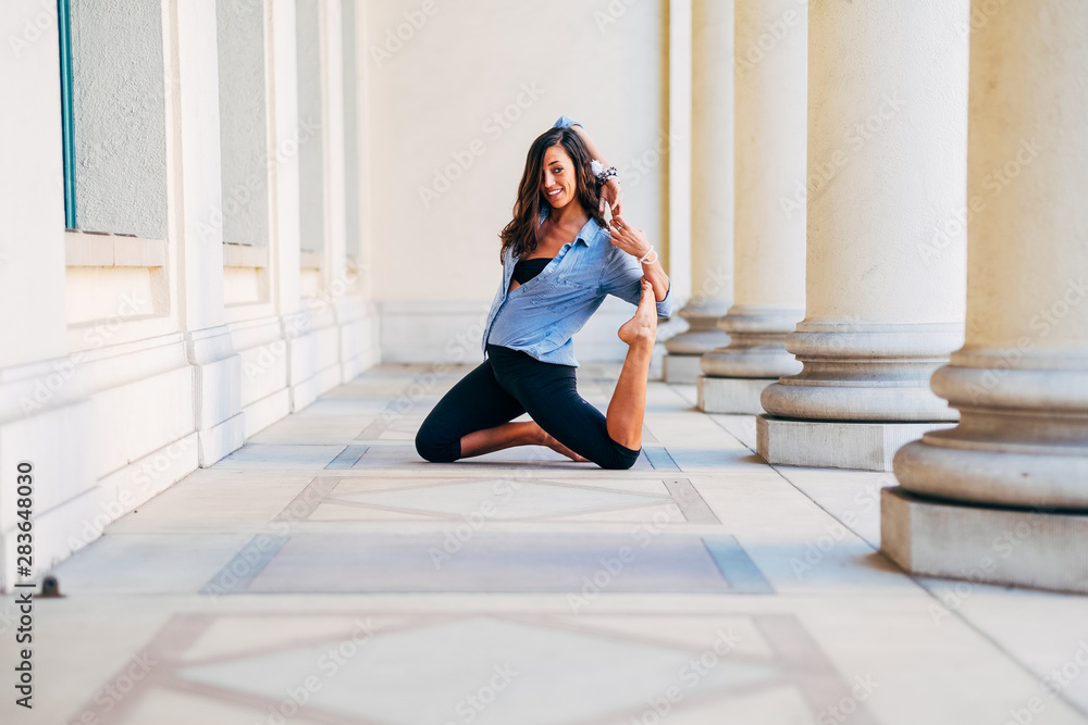 Young woman doing yoga pose