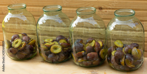 Plums placed in jars - Plum compote in the cooking process
