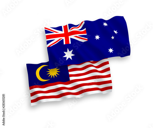 National vector fabric wave flags of Australia and Malaysia isolated on white background. 1 to 2 proportion.