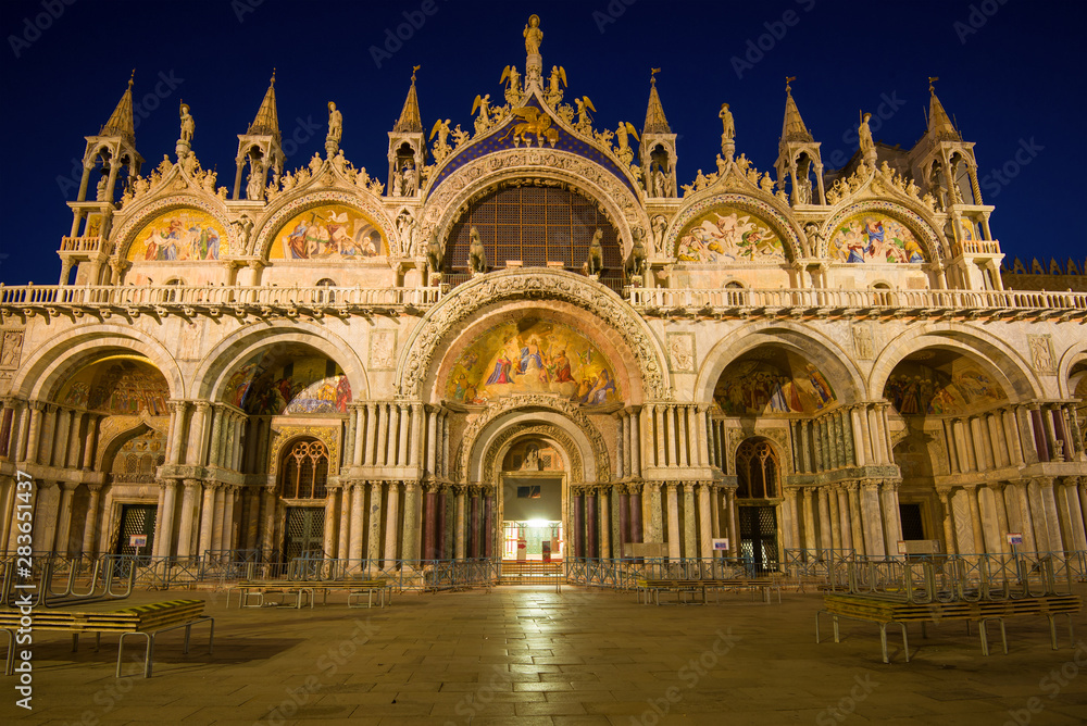 Facade of old St. Mark Basilica close up in night illumination. Venice, Italy