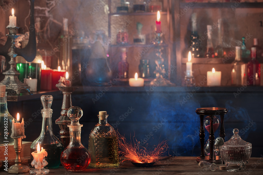 magic potions in bottles on wooden background Stock Photo | Adobe Stock