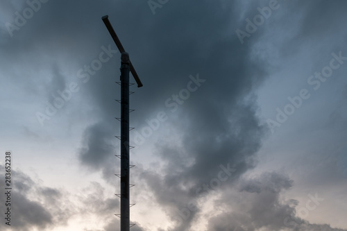 Electric pole in the dark sky.