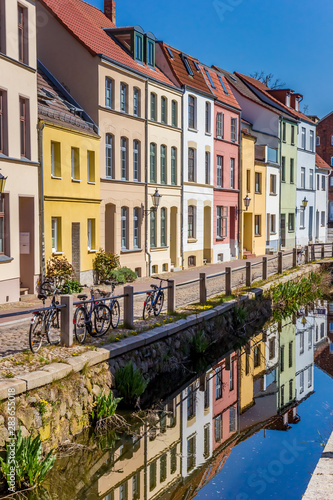 Colorful houses with reflection in the canal in Wismar, Germany