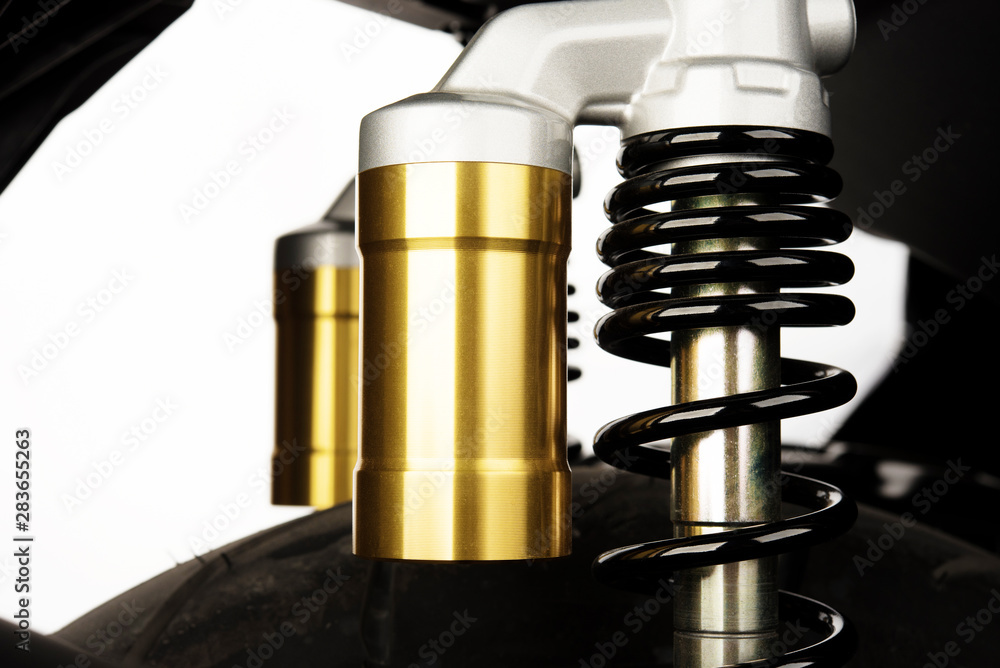 New modern motorcycle shock absorber spring isolated on white background New modern motorcycle shock absorber spring isolated on white background