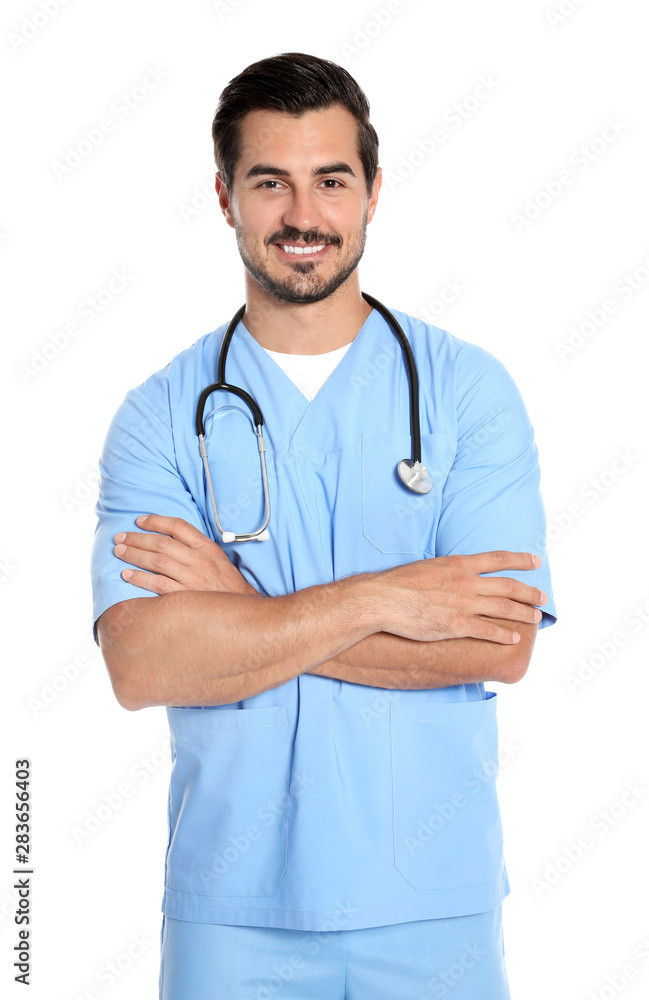 Young male doctor in uniform with stethoscope on white background. Medical service Young male doctor in uniform with stethoscope on white background. Medical service