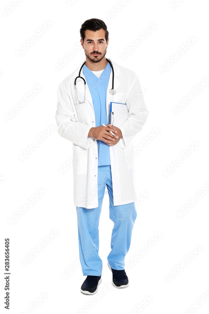 Young male doctor in uniform with stethoscope and clipboard on white background. Medical service Young male doctor in uniform with stethoscope and clipboard on white background. Medical service