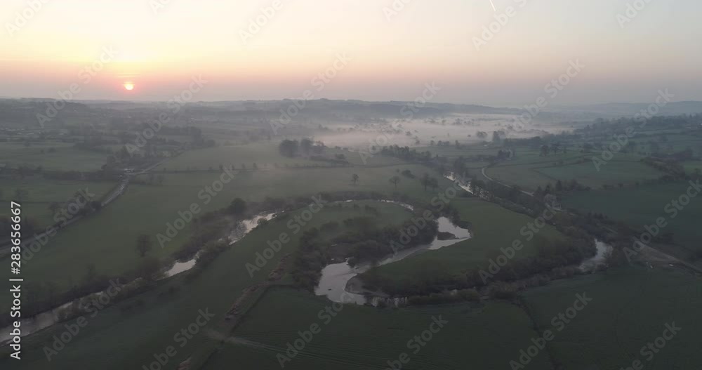 Sunrise over river in the foggy countryside in north Yorkshire. Sunrise over river in the foggy countryside in north Yorkshire.
