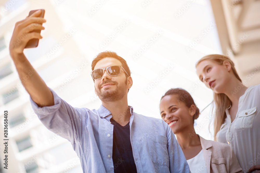 A group of independent businesses are using phone selfie. A group of independent businesses are using phone selfie.