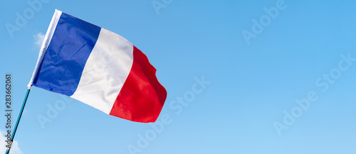 Fotografie, Obraz Flag of France waving in the wind in the sky