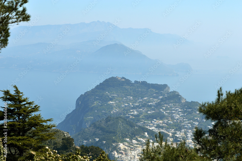 Beautiful landscape of the mountains in the fog on the island of Capri in Italy.