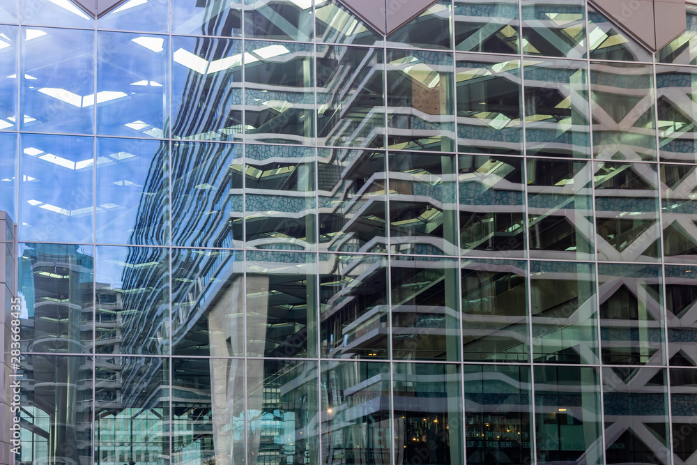 View of the buildings around the Central Station, reflected in the windows on the side of the main building, The Hague, Netherlands View of the buildings around the Central Station, reflected in the windows on the side of the main building, The Hague, Netherlands