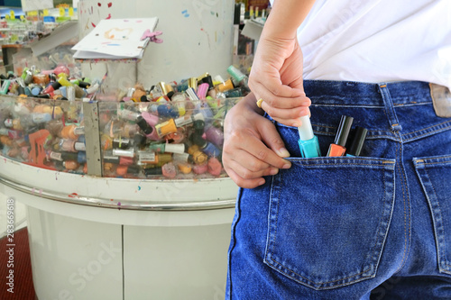 woman trying to steal items in a department store, (Pathological stealing, Kleptomania)