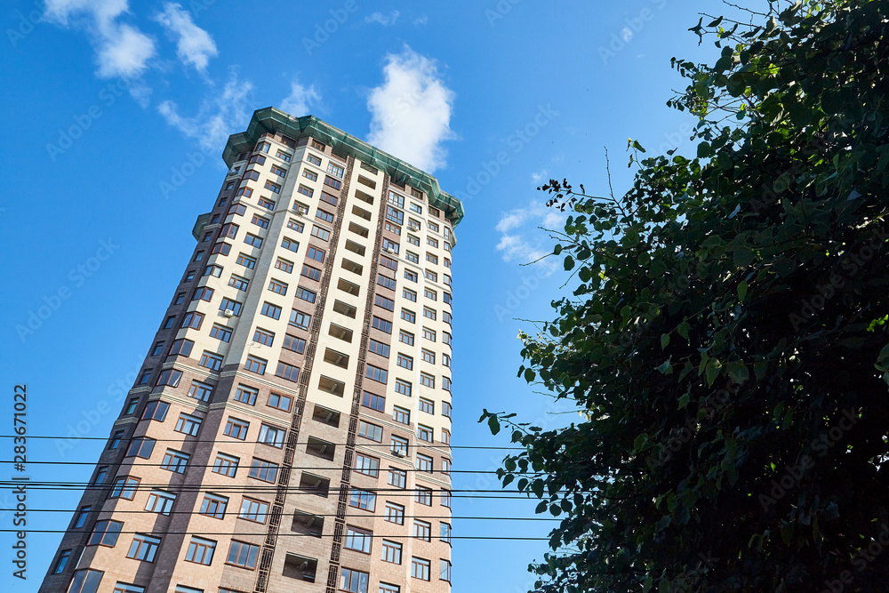 High apartment building in a summer day