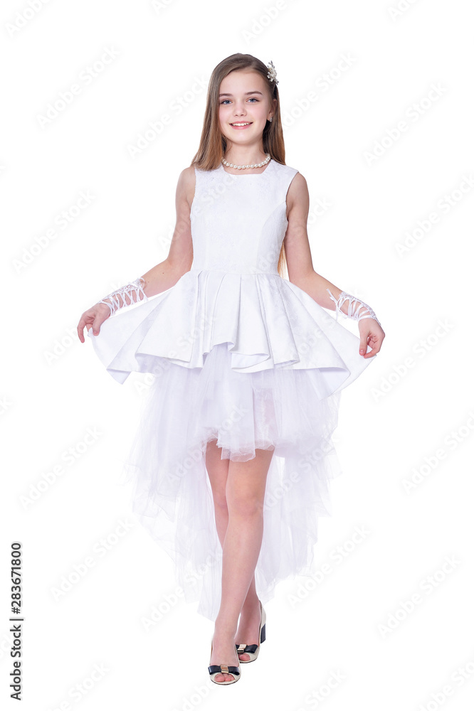 Happy beautiful little girl in white dress posing isolated Happy beautiful little girl in white dress posing isolated