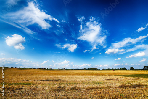 Beautiful cloudy sky over summer fields
