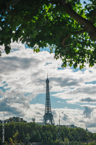 Eiffel tower with blue sky in a cloudy day © Halit