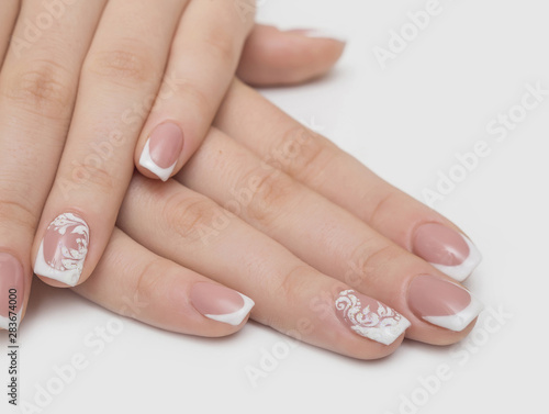 Manicure and white abstract pattern on women's nails