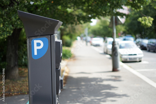 Modern parking pay station on a street allow parkers pay by card or cash
