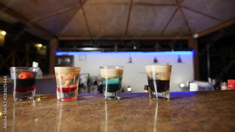 Four types of alcohol shots ready to drink. Stock ビデオ | Adobe Stock