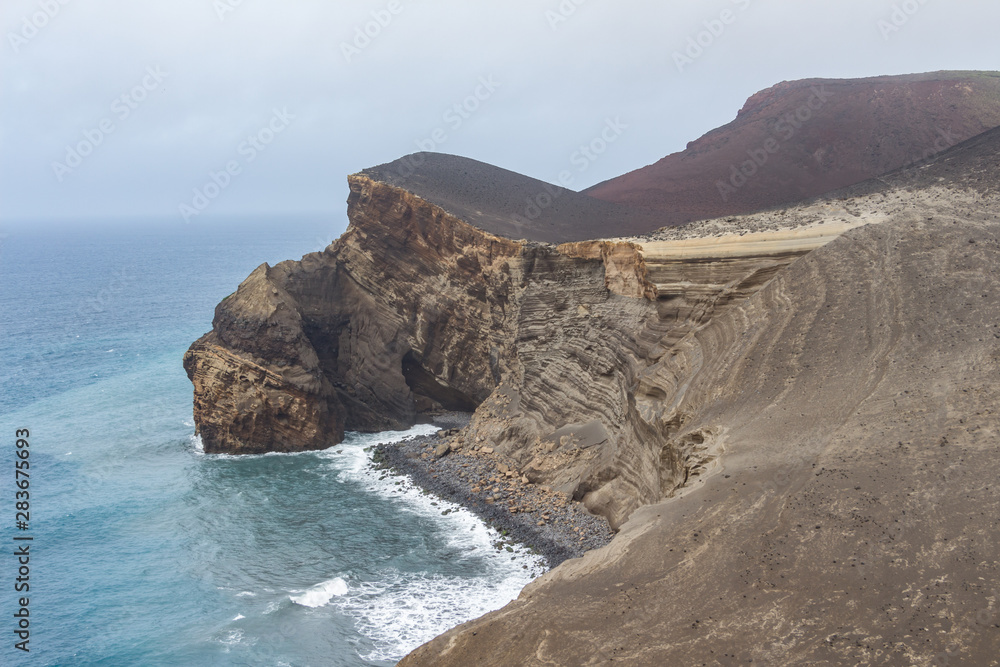 Capelinhos volcano on western coast on Faial island, Azores, Portugal. Last volcano eruption was in 1957.