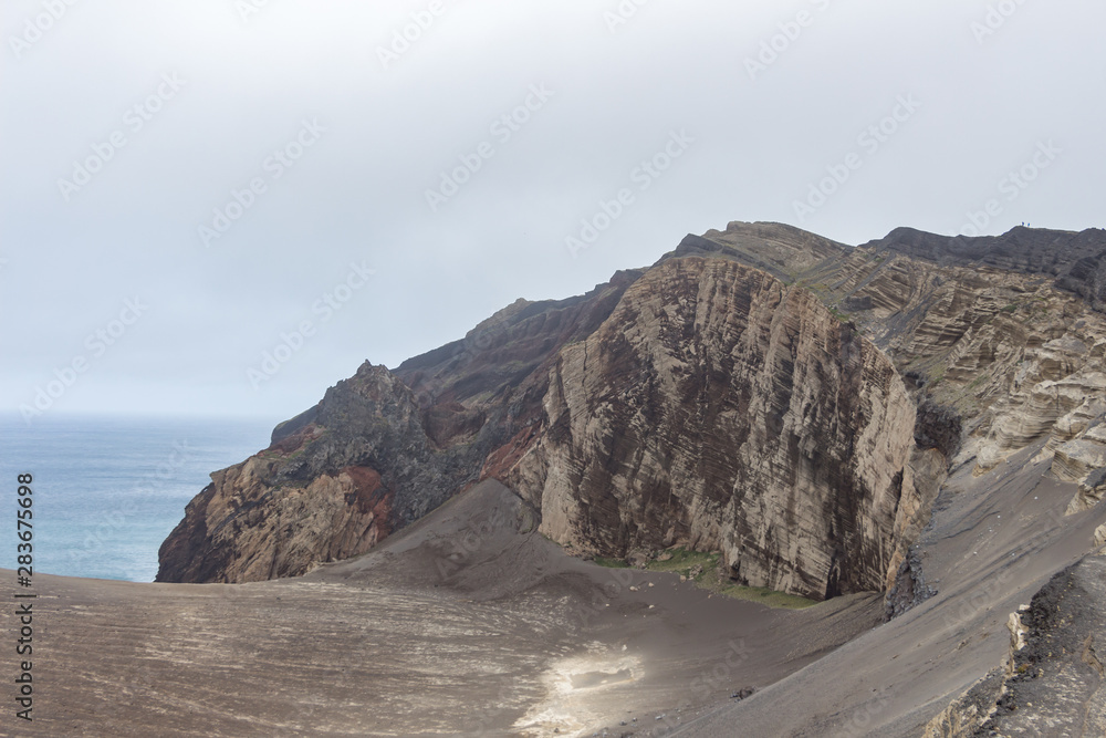 Capelinhos volcano on western coast on Faial island, Azores, Portugal. Last volcano eruption was in 1957.