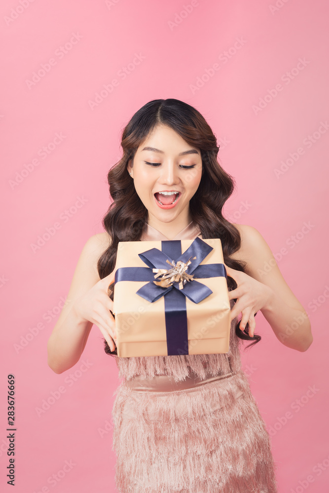 Young woman happy smile hold gift box in hands Young woman happy smile hold gift box in hands