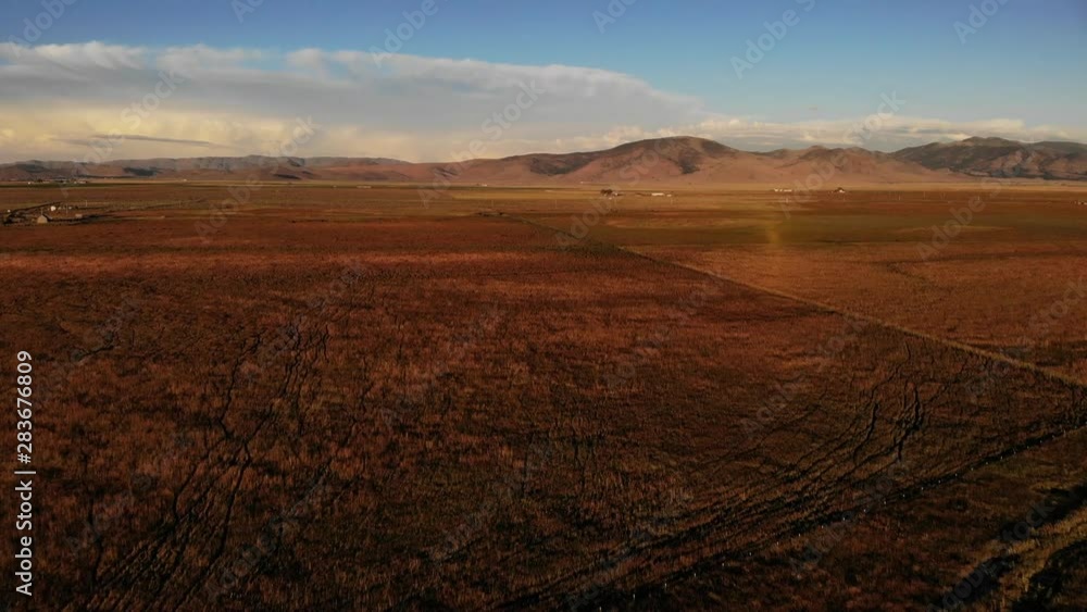 Tilt Up Over Farming Lands in Sierra Valley at Sunset - Aerial Drone. Tilt Up Over Farming Lands in Sierra Valley at Sunset - Aerial Drone.