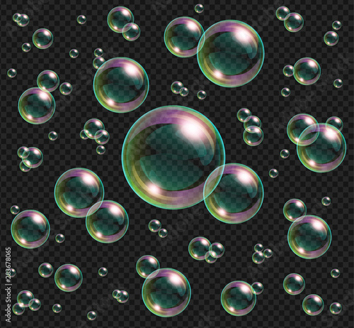 Realistic soap bubbles with rainbow reflection isolated on transparent background.