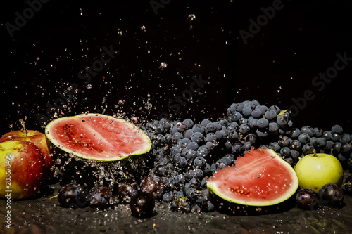 grapes and watermelon in spray of water