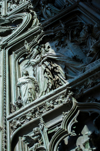 Beautiful wooden sculptures on the door of Milan chapel