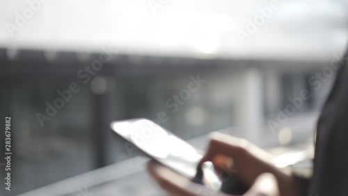Young man using apps on a touchscreen smartphone - Concept for using technology, shopping online, using mobile apps, texting, phone addiction.